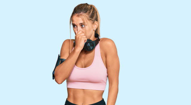 woman smelling in the gym